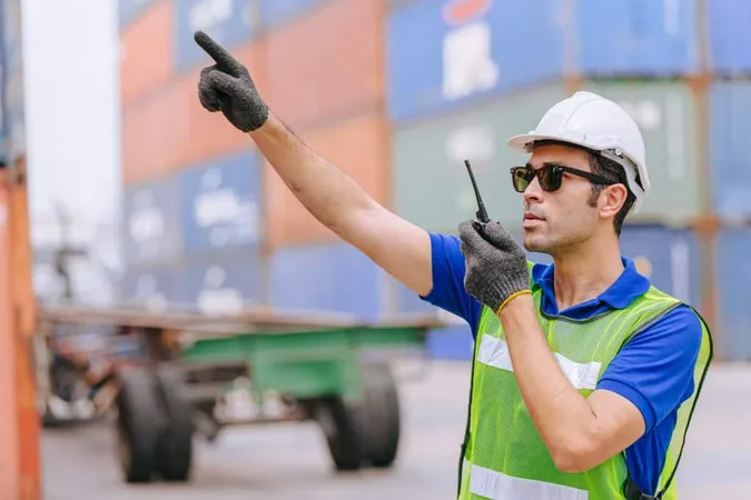 Hispanic Male Port Cargo Shipping Worker Working Radio Control Operate Port Cargo Shipping Customs Container Yard X - Rigger and Signal Person Certification study guide