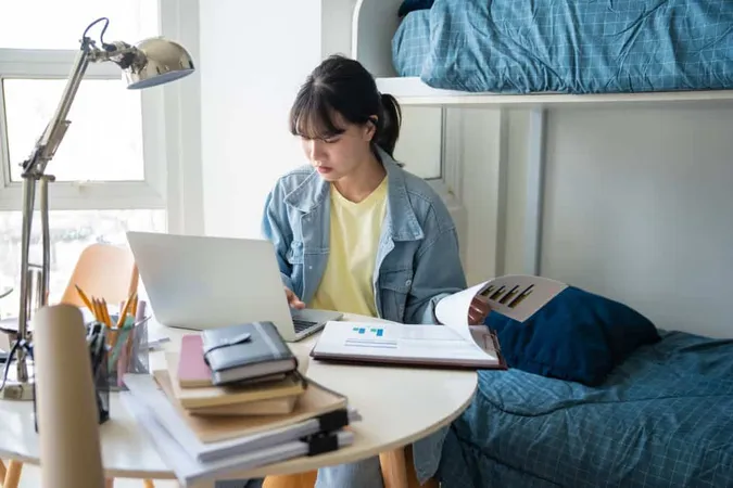 Student Asian Woman Sitting Bed Dorm Room College Student Work Homework Laptop University Dormitory X - Selective Entry High Schools study guide