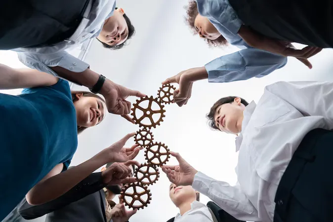 Office Worker Holding Cog Wheel As Unity Teamwork Workplace Concord - Society for Industrial and Organizational Psychology Certification study guide