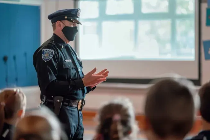 Police Officer Is Teaching Students Classroom Setting Police Officer Giving Presentation School Children About Safety X - School Resource Officer Certification study guide