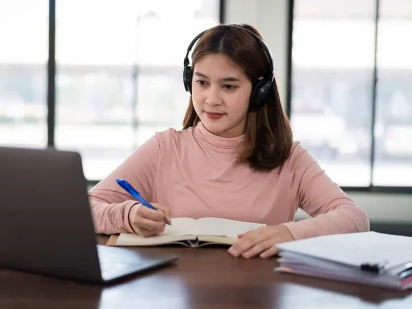 Mid Adult Woman Using Mobile Pho - TOEFL study guide