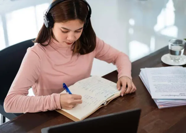 Smiling Asian Girl Student Wears - TOEFL study guide