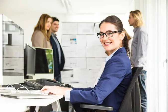 Portrait Businesswoman Sitting Desk While Colleagues Discussing Background Office X - Test of Workplace Essential Skills study guide