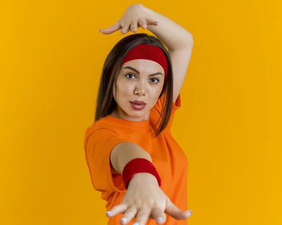 Confident Young Sporty Woman Wearing Headband Wristbands Stretching Out Hand Towards Looking Keeping Another Hand Head Isolated R3cvgnlddsxw7fzj6yhufk7s8i3tnaj7uukg - Zumba Instructor Certification study guide
